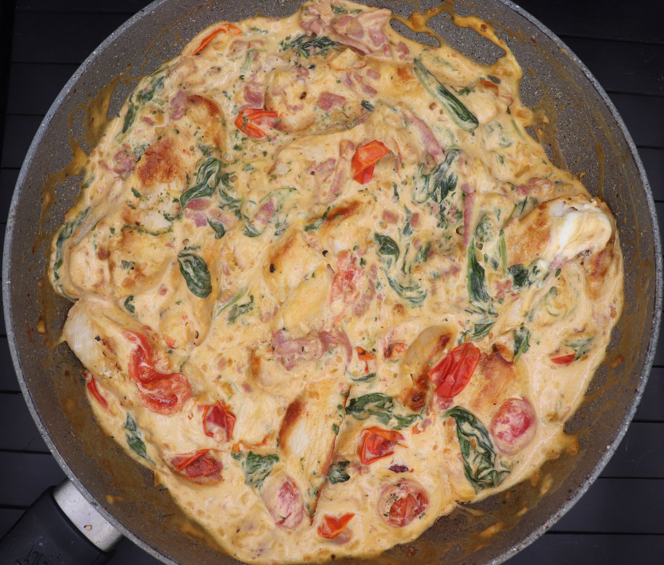 Sautéed Chicken with Garlic and Spinach in Creamy Tomato Sauce