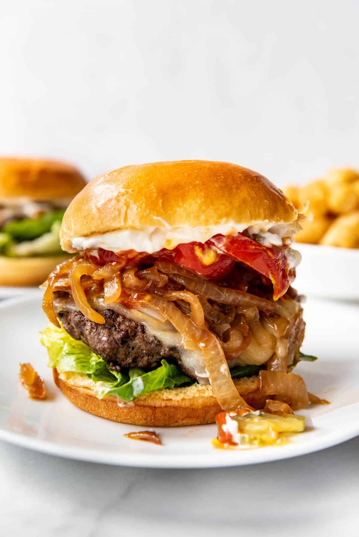 Grilled Prairie Bison Burgers with Caramelized Onions and Smoked Cheddar