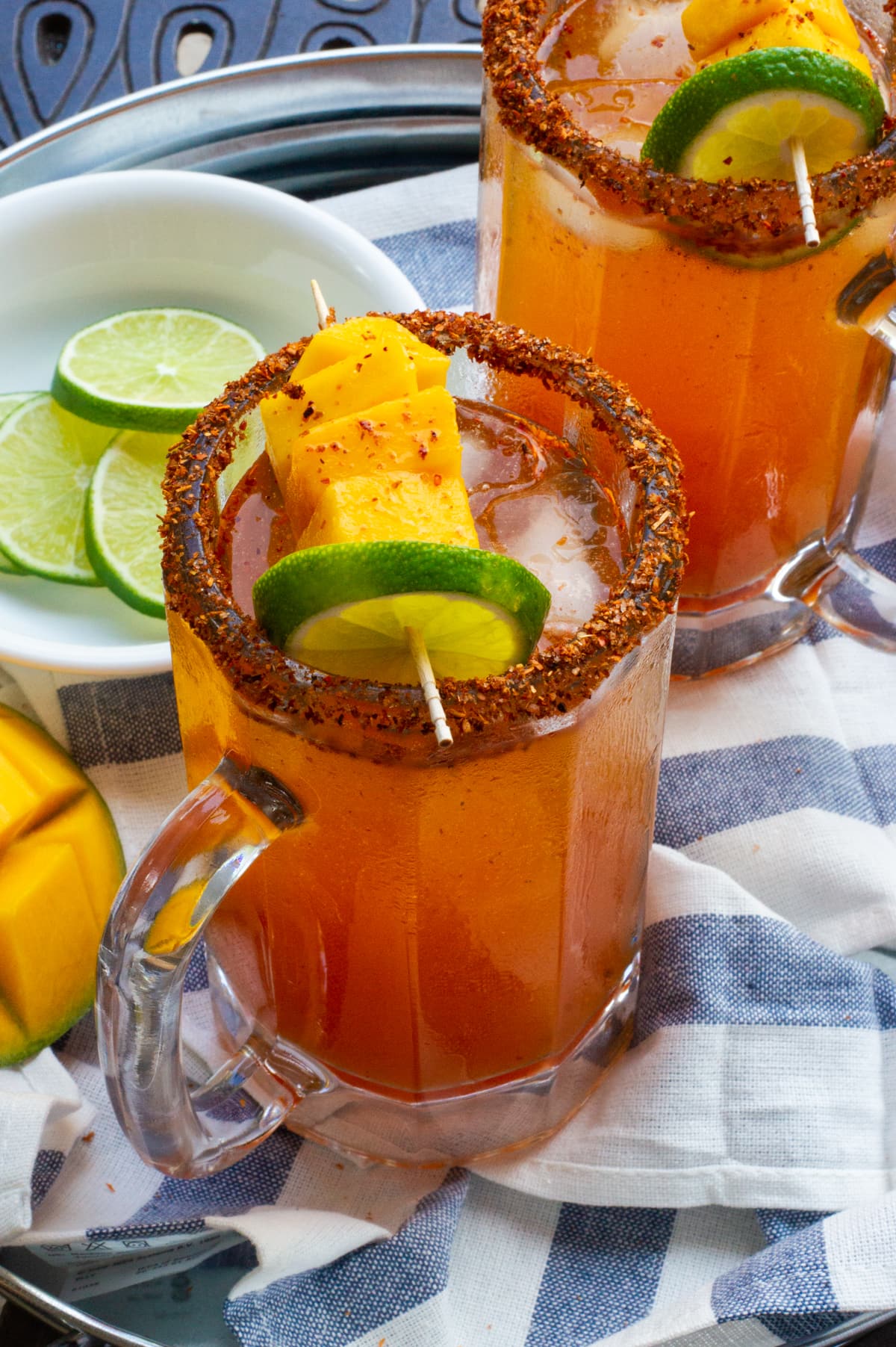 Spicy Mango Michelada Cocktail with Tajín Rim