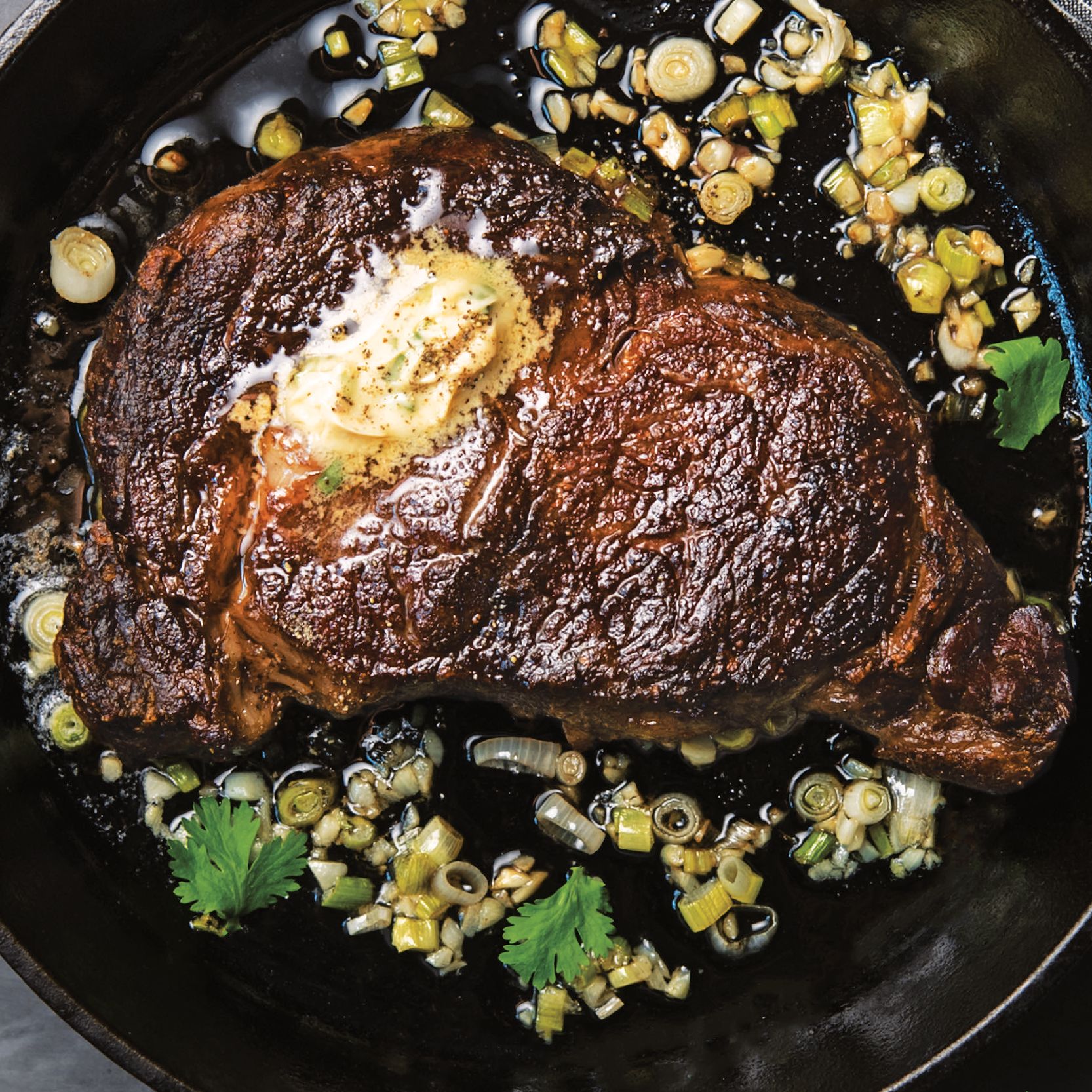 Pan-Seared Ribeye with Garlic Butter and Herb Jus