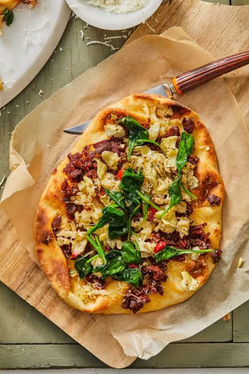 Sun-Dried Tomato and Artichoke Flatbread with Mixed Greens